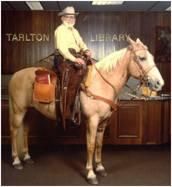 Photo of Roy Mersky on a horse in the Tarlton Library