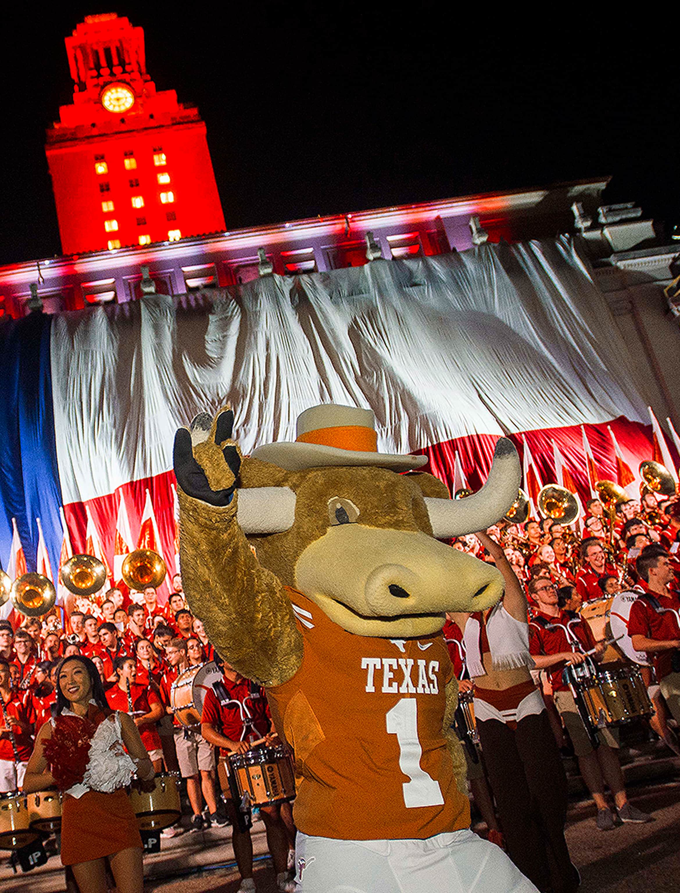 Hook 'em in front of the UT band, cheer team, and Tower.