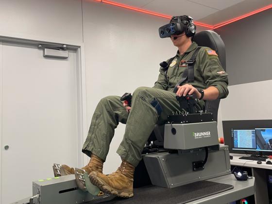 A pilot demonstrates a virtual reality flight simulator.