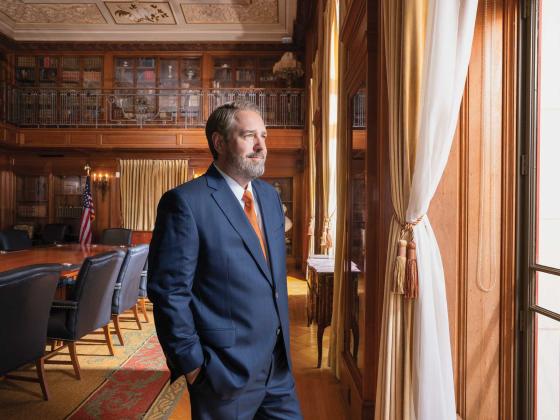 UT President Jim Davis looks out a window in the UT Tower.
