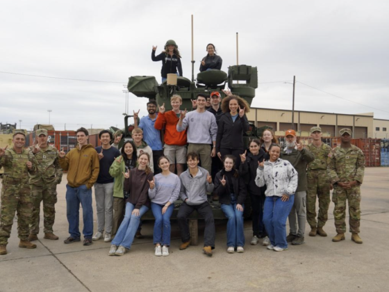 A group of people pose for a photo at Fort Hood.