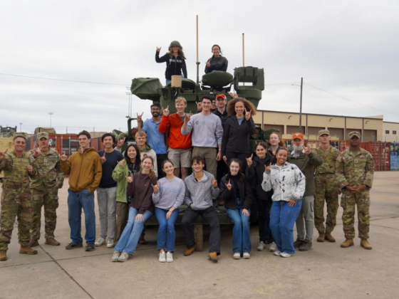 A group of people pose for a photo at Fort Hood.