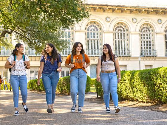 A group of students walking on the University of Texas at Austin campus