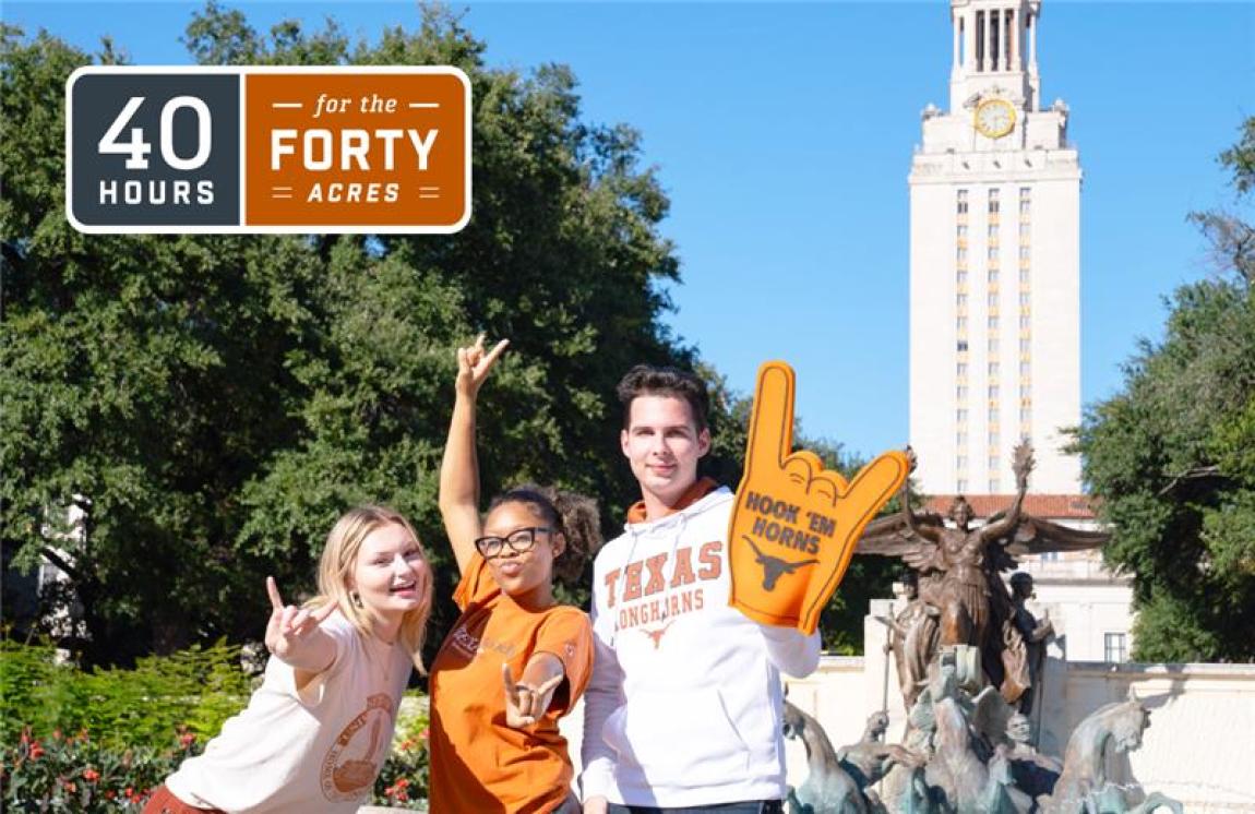 Three students holding Hook 'em hand symbol with Tower in background 