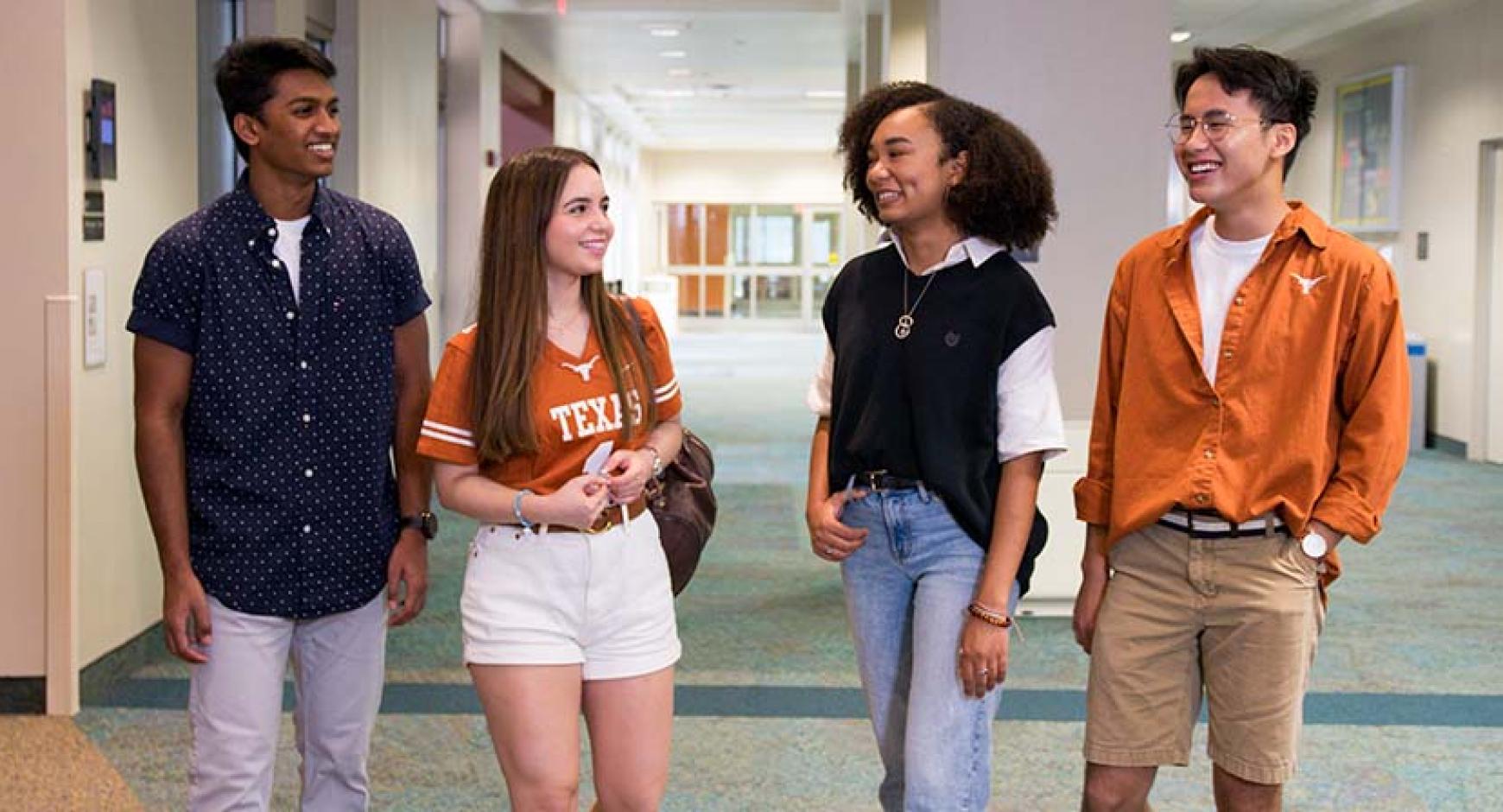 Students talking in a dorm hallway