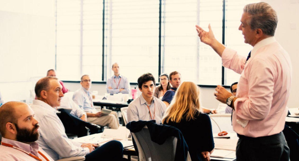 Man speaking in front of a classroom