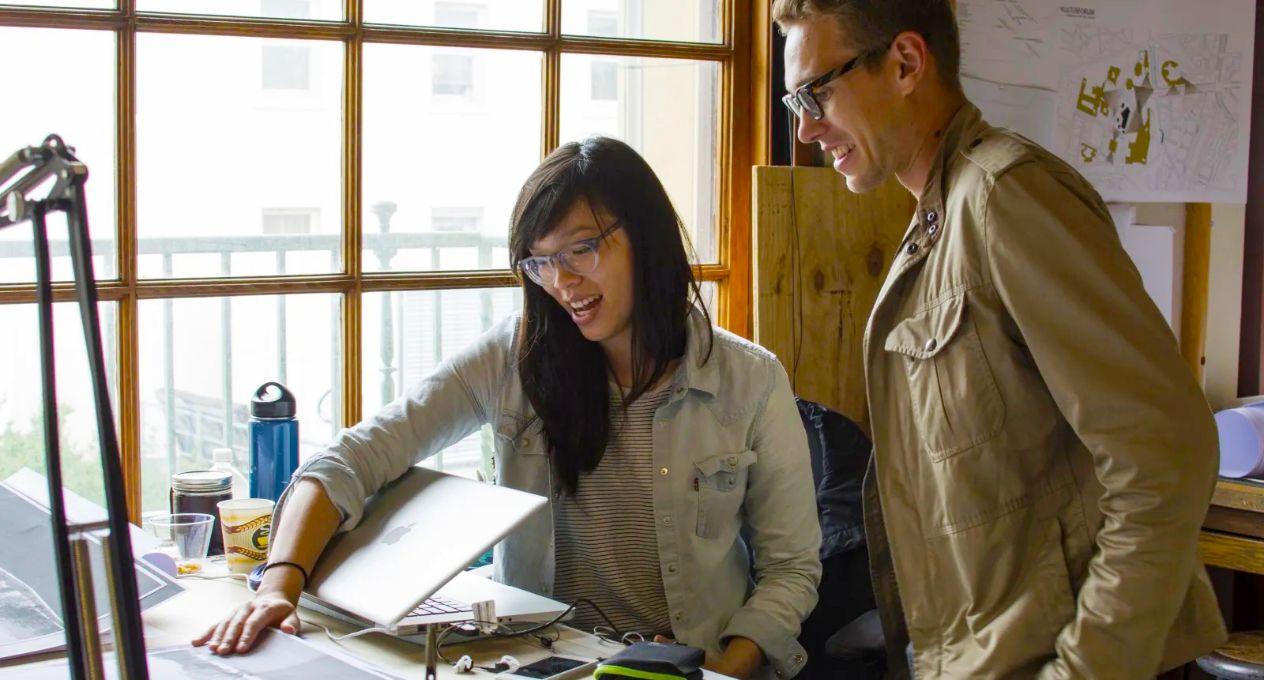 Two UT Architecture students discussing a project