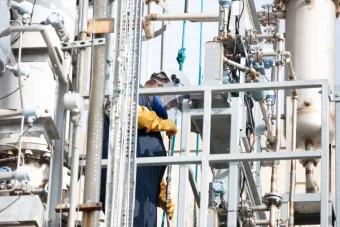 Worker at a carbon recapture facility