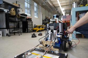 student working on a robot