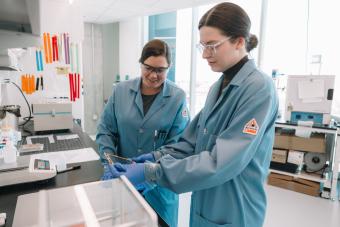 Researchers with Celadyne Technologies inspect a membrane developed in the lab which is used to improve hydrogen devices.