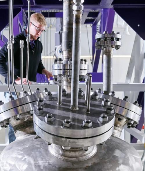 Research working using lab equipment