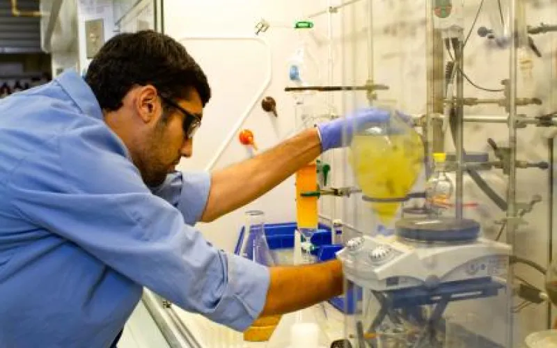 Student monitors a beaker