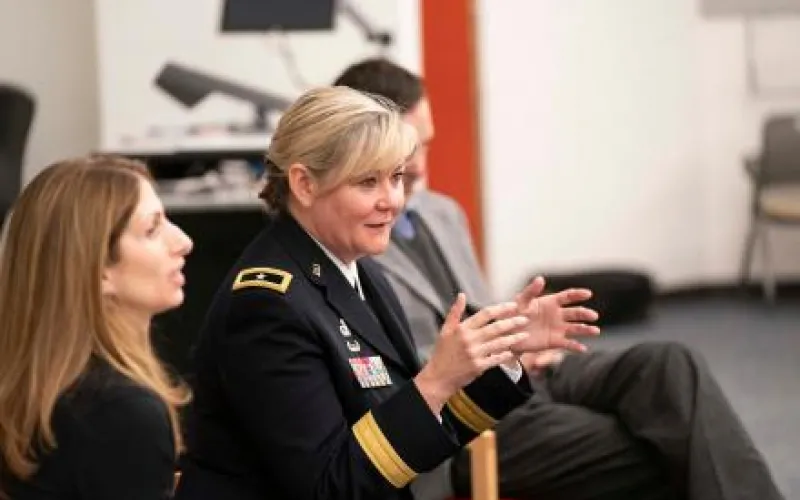 Woman in military uniform speaking
