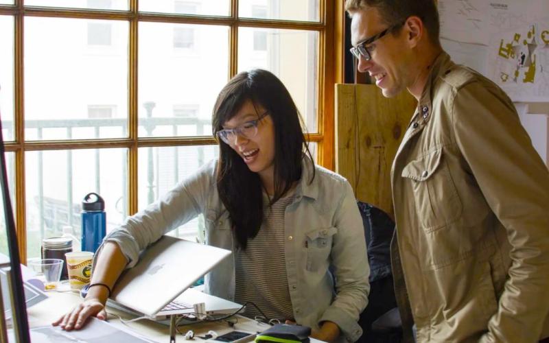 Two UT Architecture students discussing a project