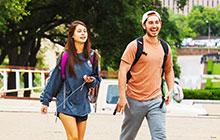 students walking across the main mall on the University of Texas campus